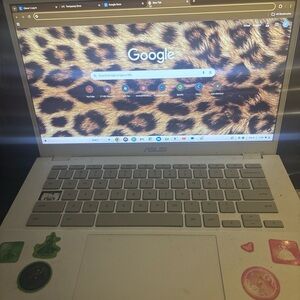 ASUS White Laptop with Leopard Print Display